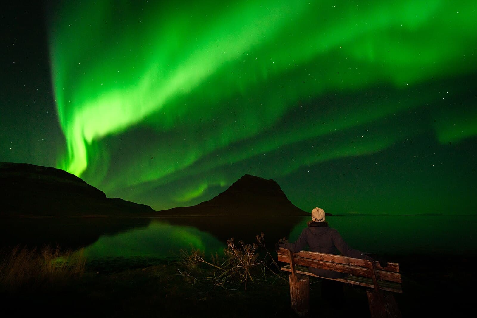 Northern lights over a fjord